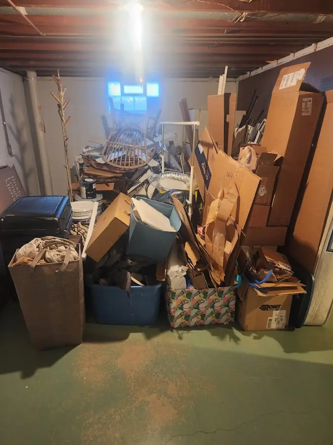 Roll-off dumpster container at job site for 15 Yard Dumpster Rental in Milton